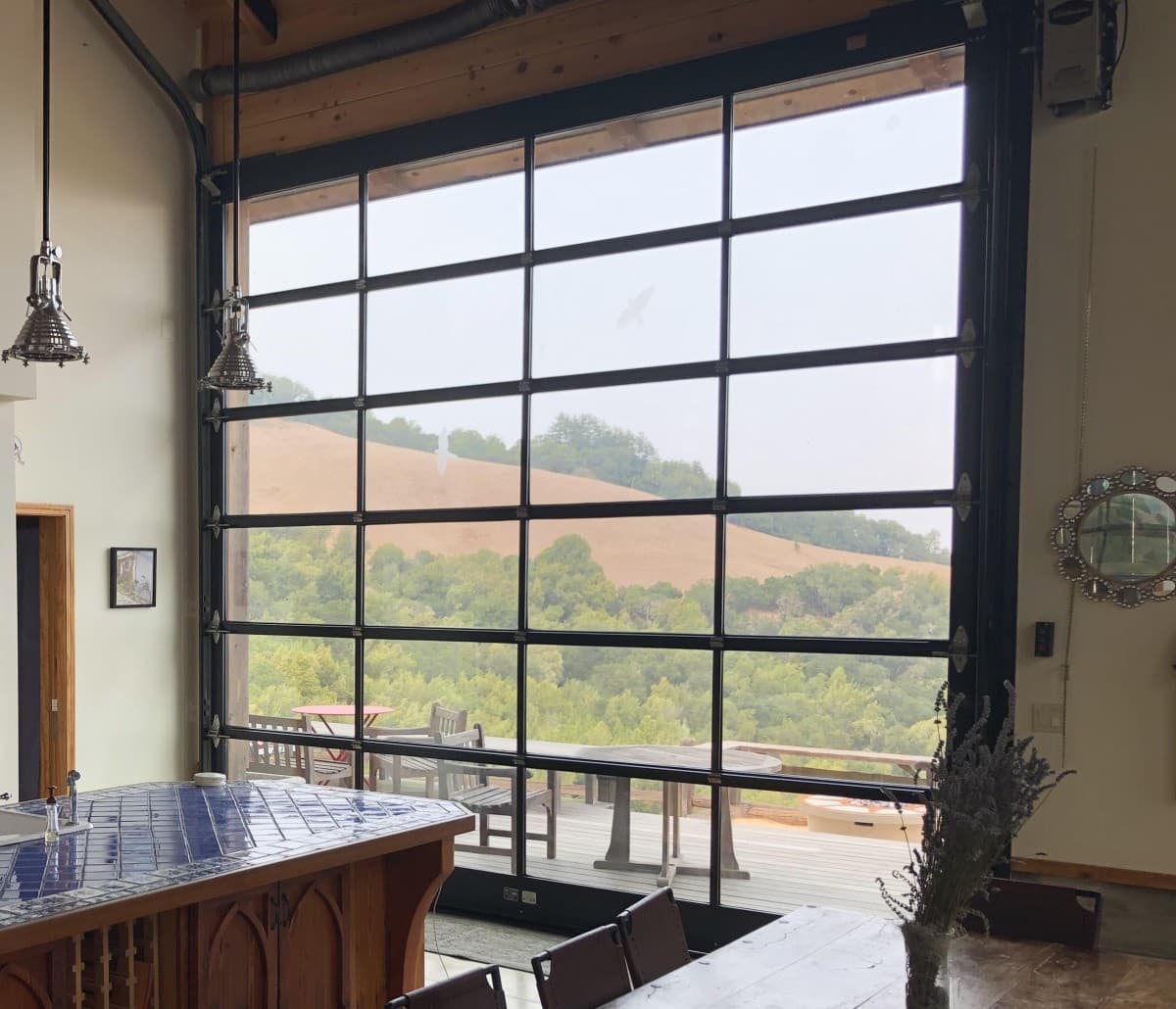 bp Overhead Glass Garage Doors Eliminate Floor Tracks and Pinch Points in Luxury Glass Walls